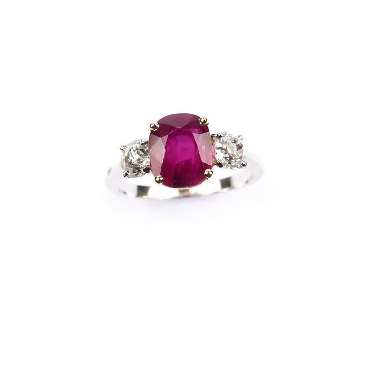 Ruby and diamond three stone ring, claw set with a cushion cut 2.52ct Burma ruby